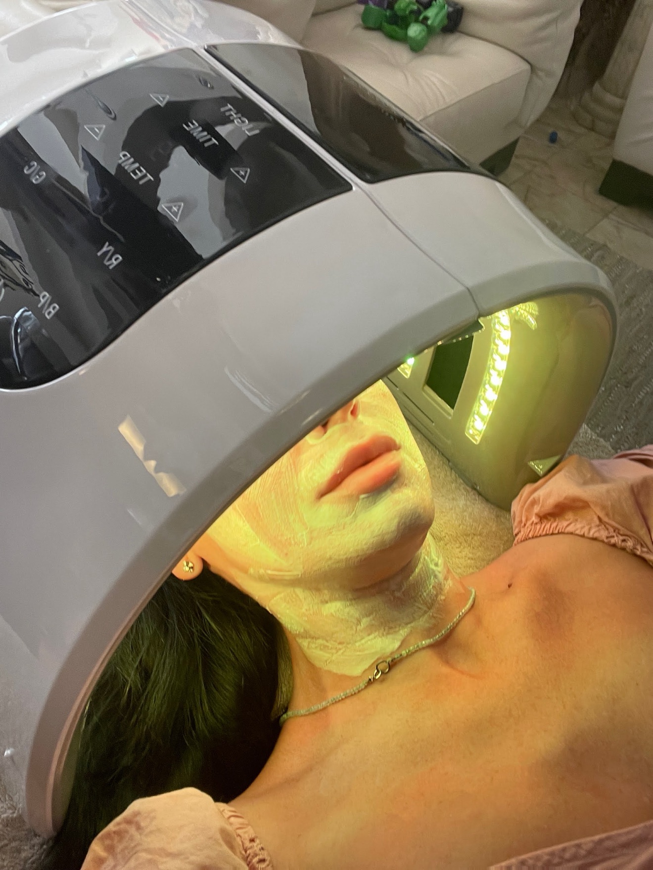 Maryna Savchenko during an LED light therapy facial treatment
